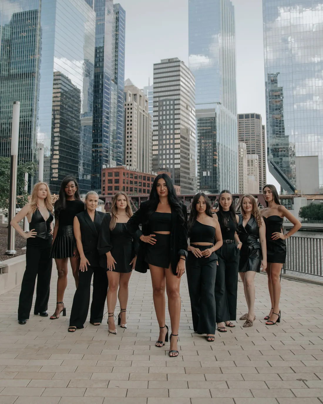 The Moxie team on the Chicago Riverwalk with the downtown skyline behind them.